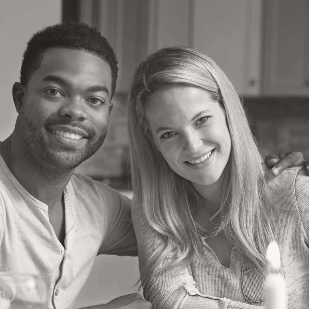 A married couple smiling together